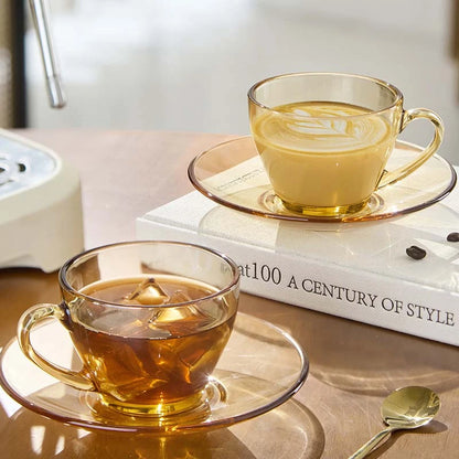 Lead-free and non-toxic amber glass cup and saucer set with precision machine-made finish.
