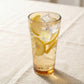 Sienna Glow amber borosilicate glass tumbler with gold Cupid decal available in 12oz and 17oz sizes.SOLA & SIENNA
