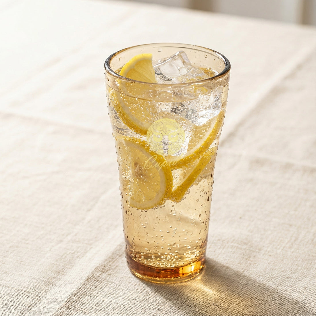 Sienna Glow amber borosilicate glass tumbler with gold Cupid decal available in 12oz and 17oz sizes.SOLA & SIENNA