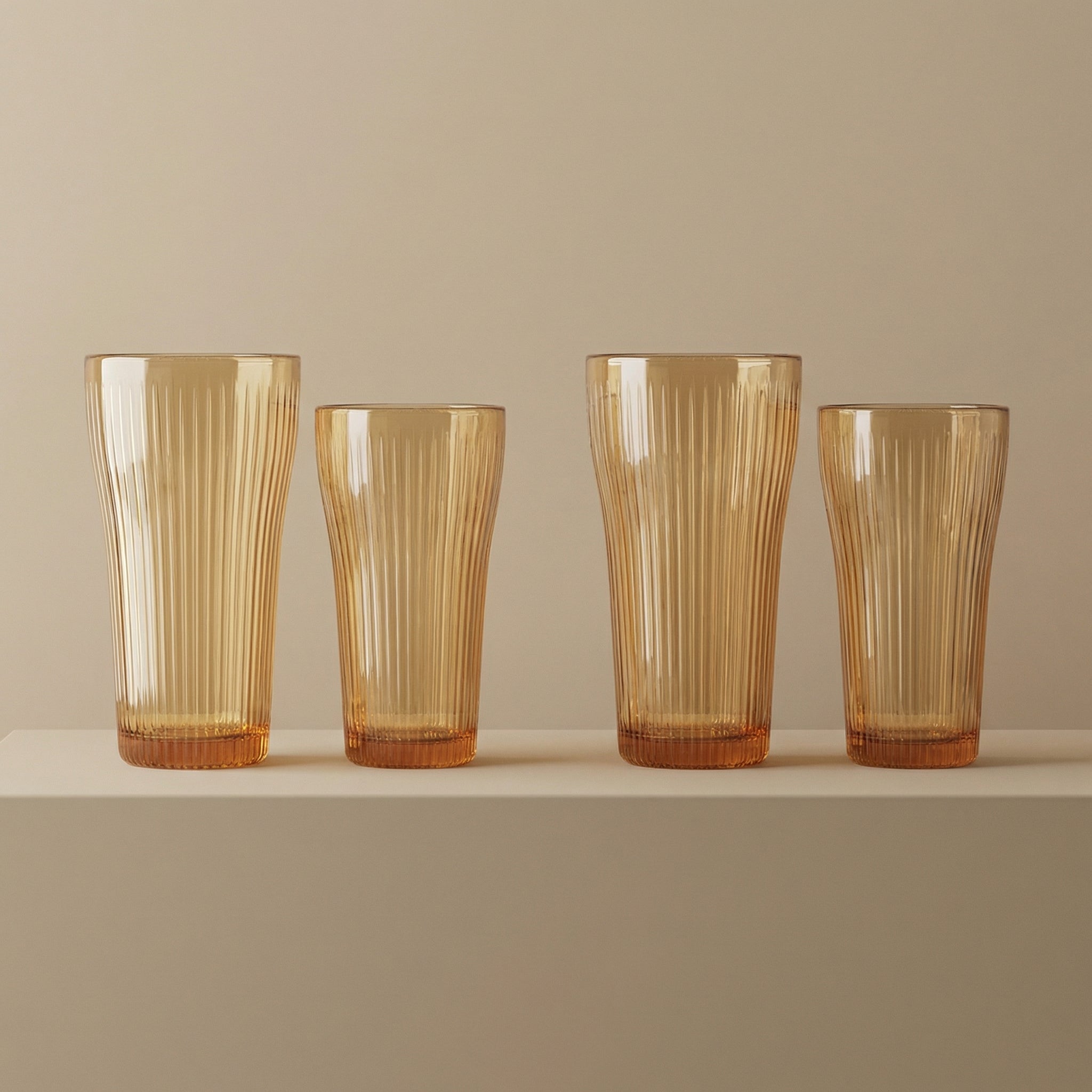 Sienna Glow ribbed amber glass tumbler in 12oz and 17oz sizes made of heat-resistant high borosilicate glass.SOLA & SIENNA