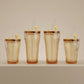 Sienna Glow ribbed amber glass tumbler in 12oz and 17oz sizes made of heat-resistant high borosilicate glass.SOLA & SIENNA