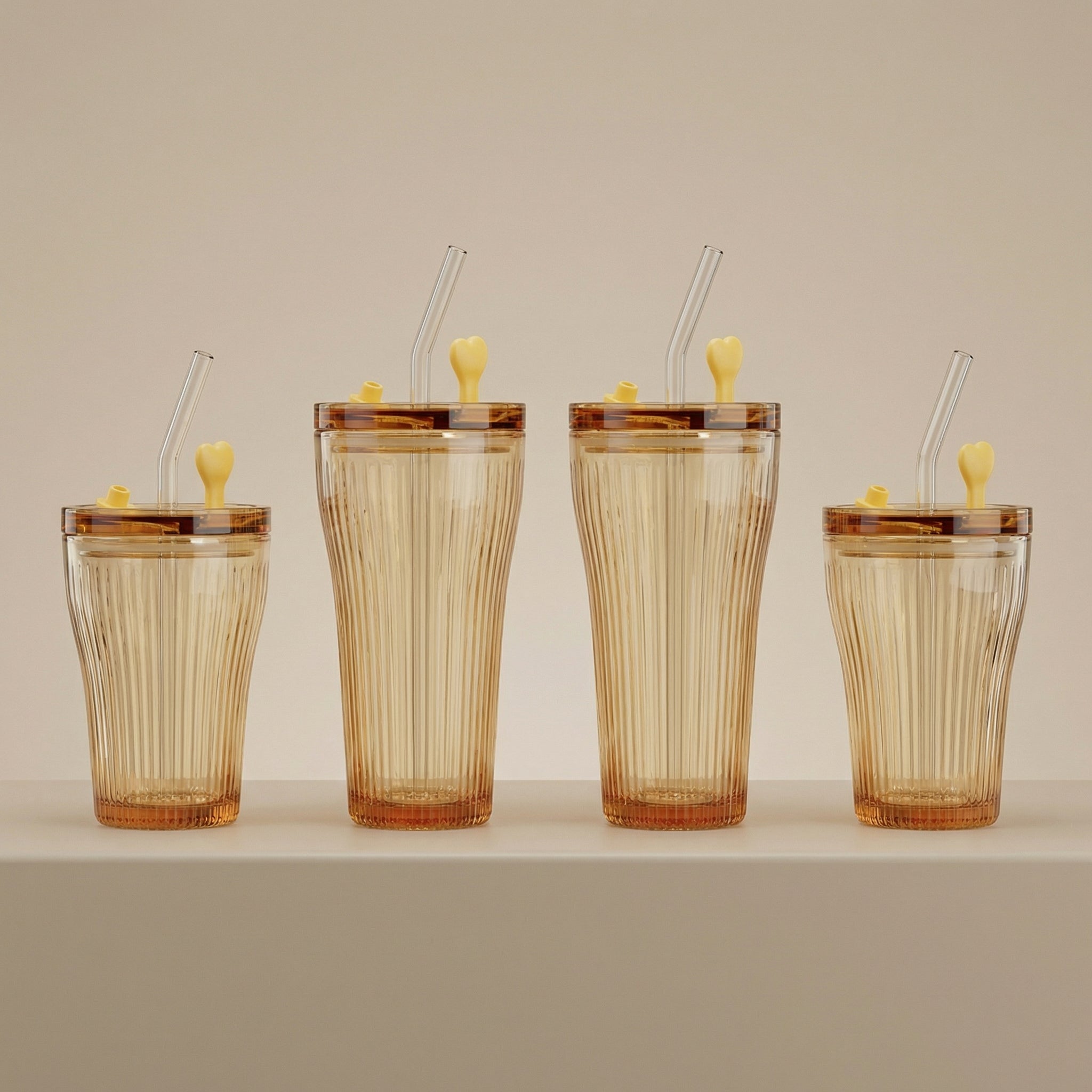 Sienna Glow ribbed amber glass tumbler in 12oz and 17oz sizes made of heat-resistant high borosilicate glass.SOLA & SIENNA