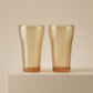 Sienna Glow ribbed amber glass tumbler in 12oz and 17oz sizes made of heat-resistant high borosilicate glass.SOLA & SIENNA