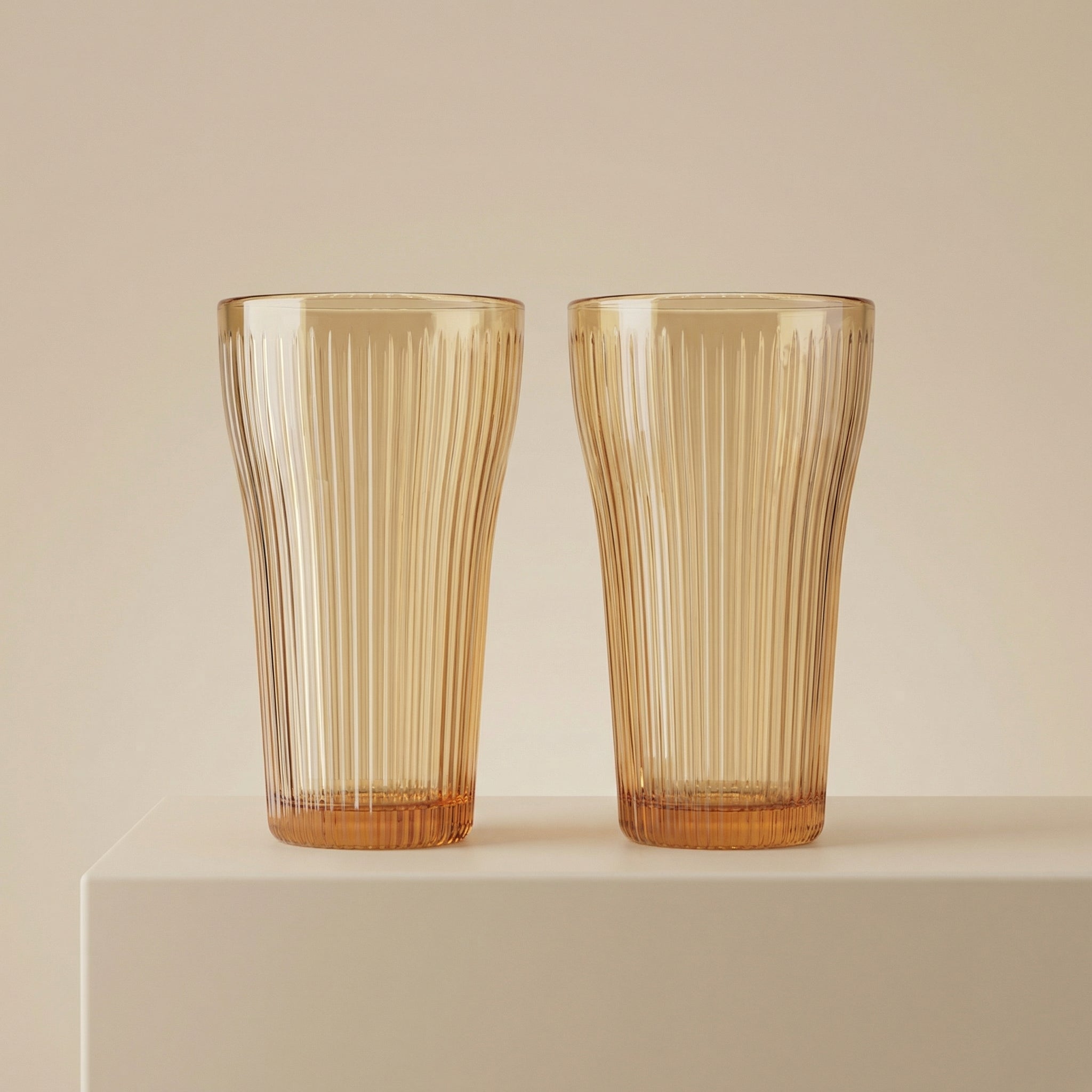Sienna Glow ribbed amber glass tumbler in 12oz and 17oz sizes made of heat-resistant high borosilicate glass.SOLA & SIENNA