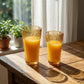 Sienna Glow ribbed amber glass tumbler in 12oz and 17oz sizes made of heat-resistant high borosilicate glass.SOLA & SIENNA