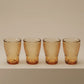Sienna Glow ribbed amber glass tumbler made of heat-resistant borosilicate glass with elegant vertical texture.SOLA & SIENNA